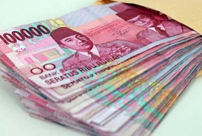 Tumpukan uang rupiah untuk ilustrasi warisan dan harta keluarga